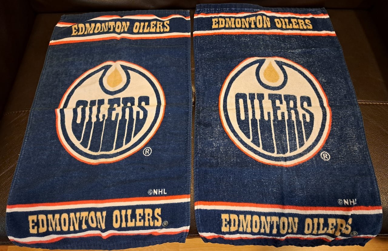 Two blue towels featuring the 